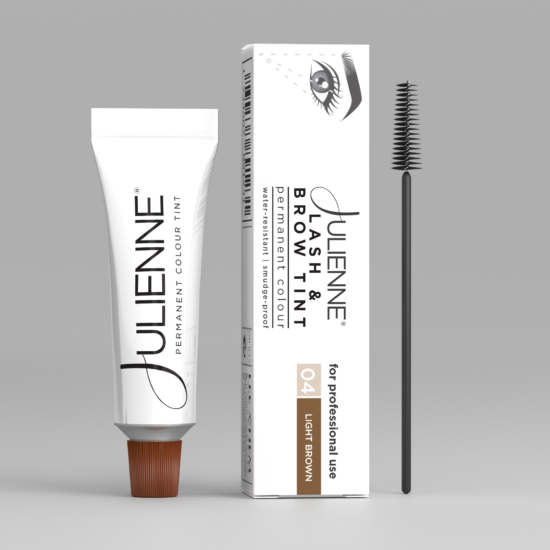 Toothpaste tube with orange cap beside a boxed cosmetic product and a mascara wand on a gray backdrop
