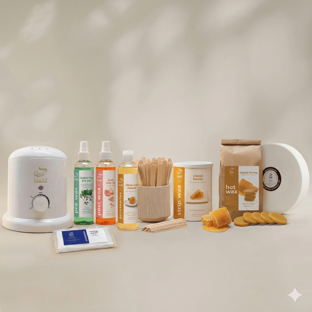 Waxing kit on a light surface: wax warmer, assortment of wax bottles, wooden spatulas, honey wax, and towels/ wipes nearby.